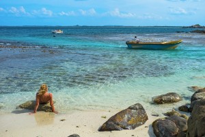 Woman sun bathing in Pigeon island, Trincomalee, Sri Lanka